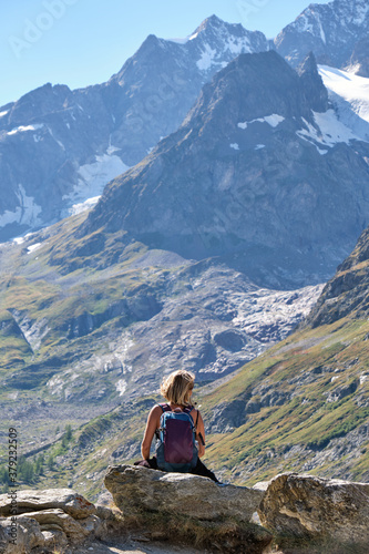 Woman hiker looking the mountains landscape