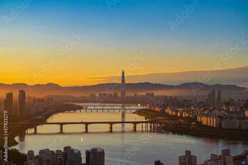 View city scapse morning in  seoul City south korea. skyscraper  and financial office beautiful construction witn han river seen from maebong mountain at summer in south korea