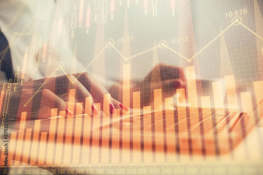 Multi exposure of woman hands typing on computer and financial graph hologram drawing. Stock market analysis concept.