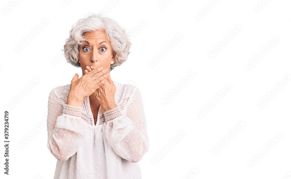 Senior grey-haired woman wearing casual clothes shocked covering mouth with hands for mistake. secret concept.