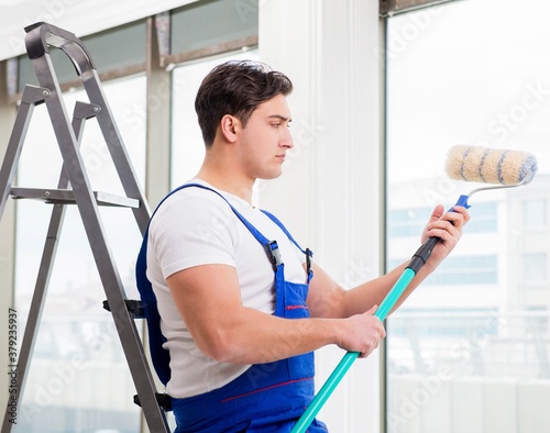 Painter repairman working at construction site