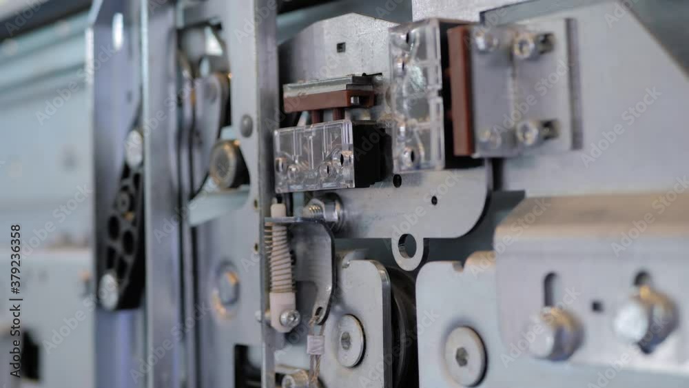 Elevator door opening and closing mechanism at lift exhibition, trade show - close up view, slow motion. Technology, engineering, machinery, equipment and electronic concept Elevator door opening and closing mechanism at lift exhibition, trade show - close up view, slow motion. Technology, engineering, machinery, equipment and electronic concept