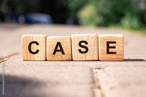 Word Case from wooden blocks on the road