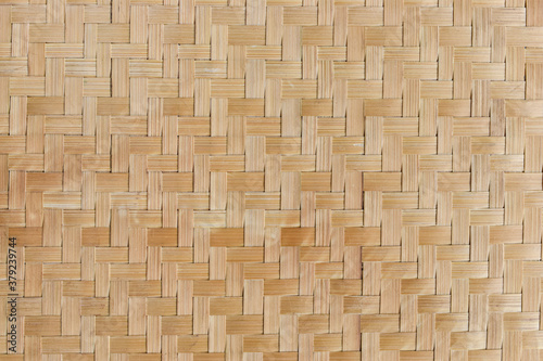 Texture of bamboo weaving. Traditional handicraft weave asian style pattern background.