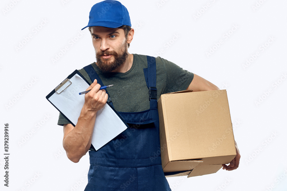 Working male courier with box in hand documents delivery service light background Working male courier with box in hand documents delivery service light background