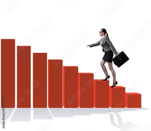 Businesswoman climbing bar chart in economic recovery concept