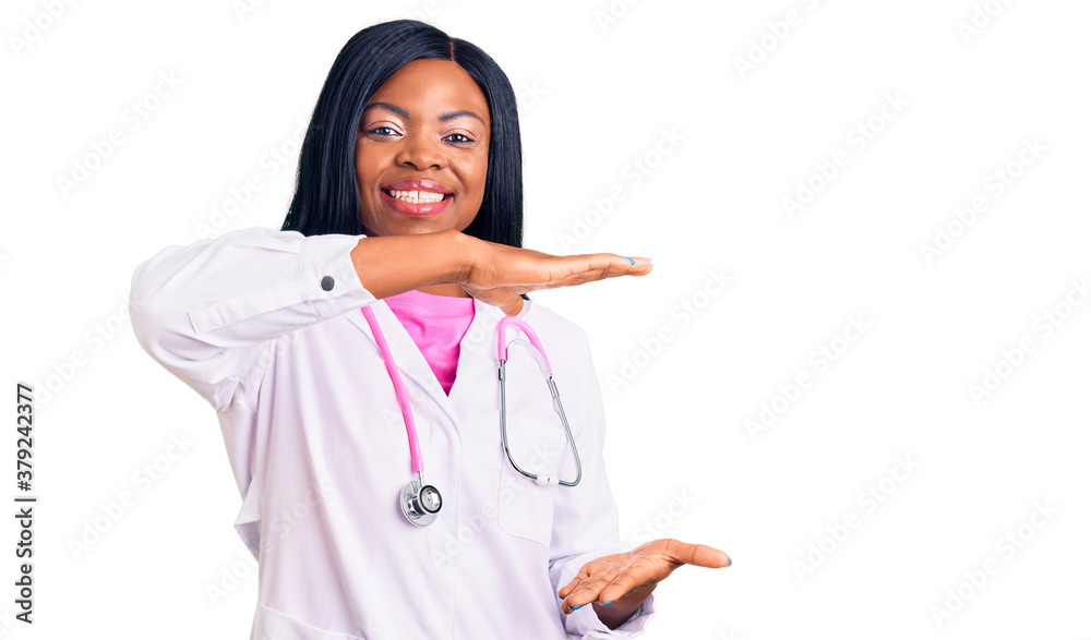 Young african american woman wearing doctor stethoscope gesturing with hands showing big and large size sign, measure symbol. smiling looking at the camera. measuring concept. Young african american woman wearing doctor stethoscope gesturing with hands showing big and large size sign, measure symbol. smiling looking at the camera. measuring concept.