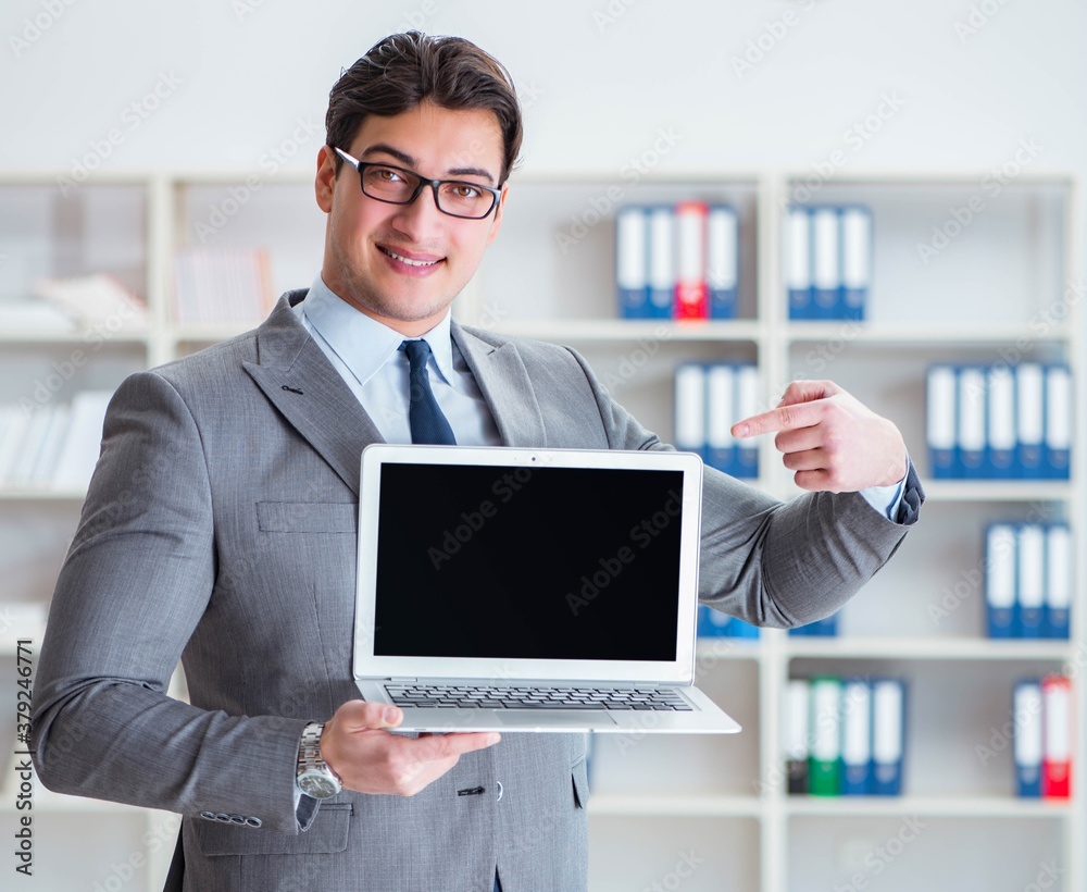 The young businessman working in the office The young businessman working in the office