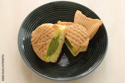 Japanese food, cream green tea Taiyaki fish shaped confectionery photo