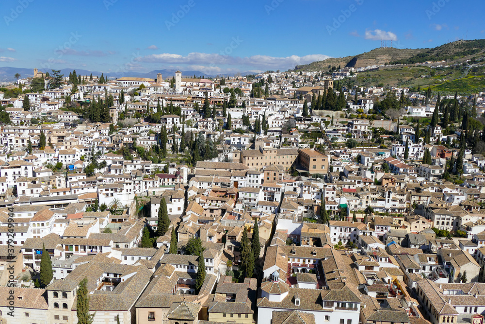 View of the City and Hillside of Beautiful Colonial Granada, Andalusia / Spain on a Clear Sunny Day