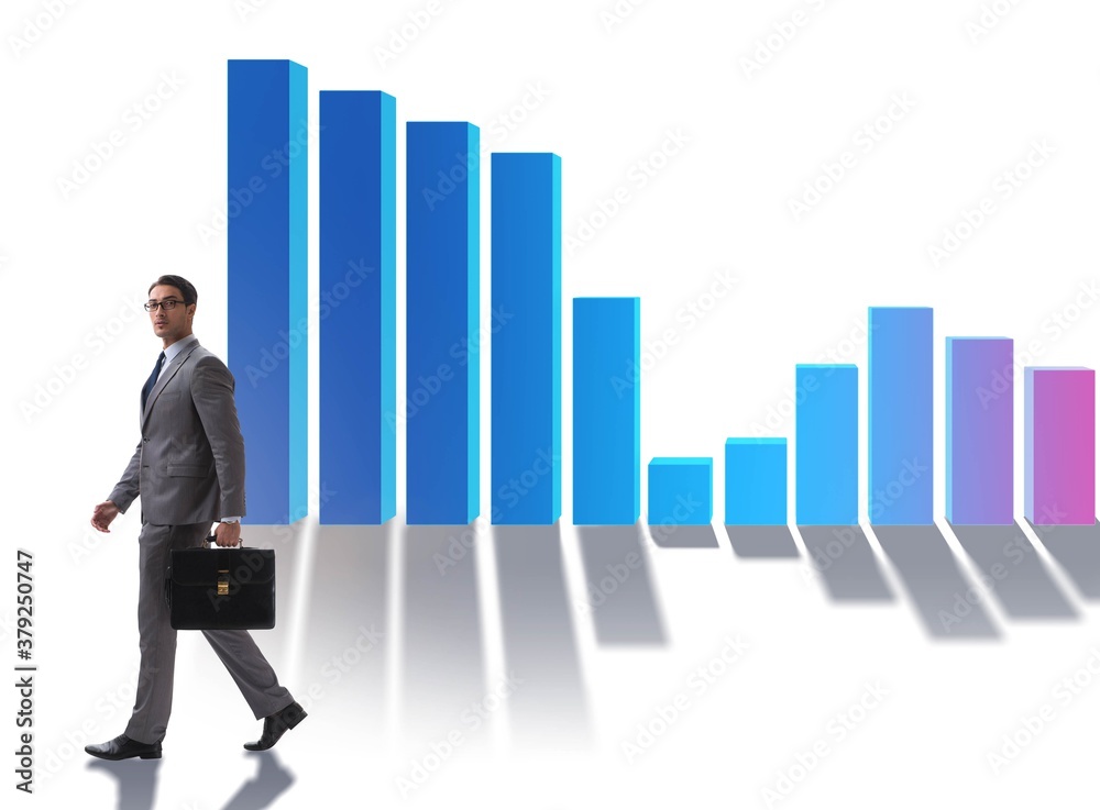 Young businessman in business concept with bar charts Young businessman in business concept with bar charts