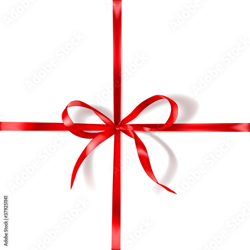 Red bow made of narrow crosswise ribbon with shadow on white background. Criss-cross arrangement