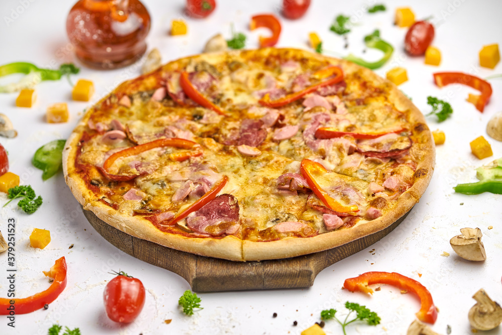 Delicious pizza with sausage, mushrooms, bell pepper on wooden plate Delicious pizza with sausage, mushrooms, bell pepper on wooden plate