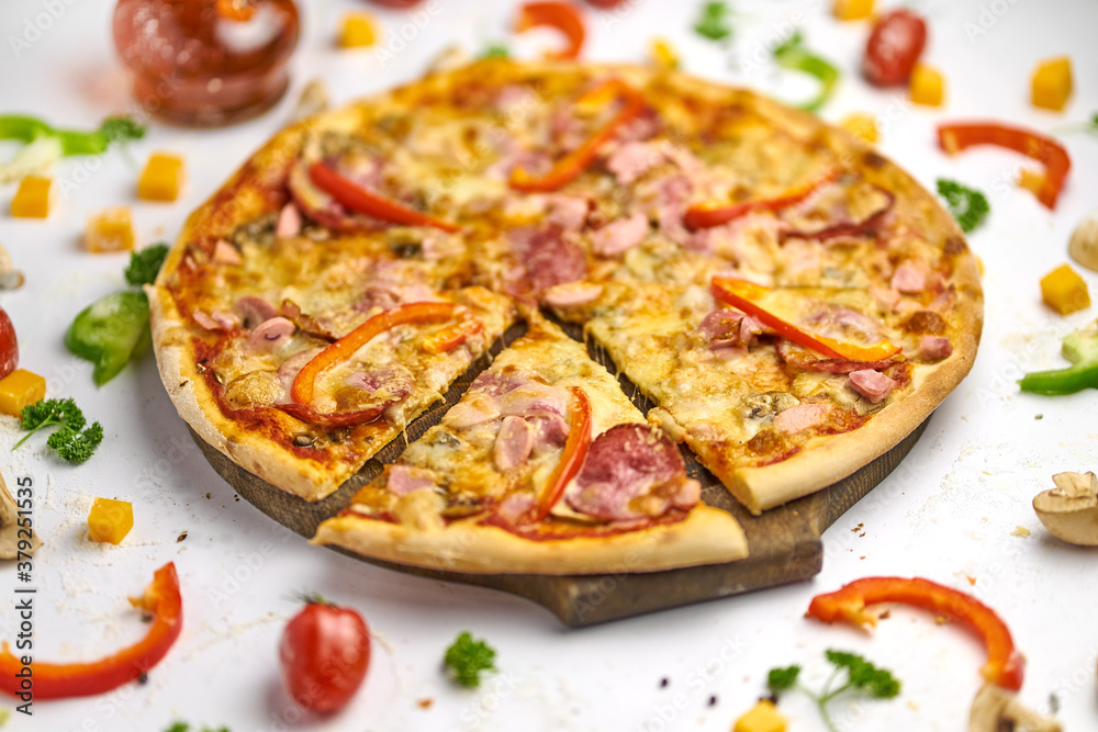 Delicious pizza with sausage, mushrooms, bell pepper on wooden plate Delicious pizza with sausage, mushrooms, bell pepper on wooden plate