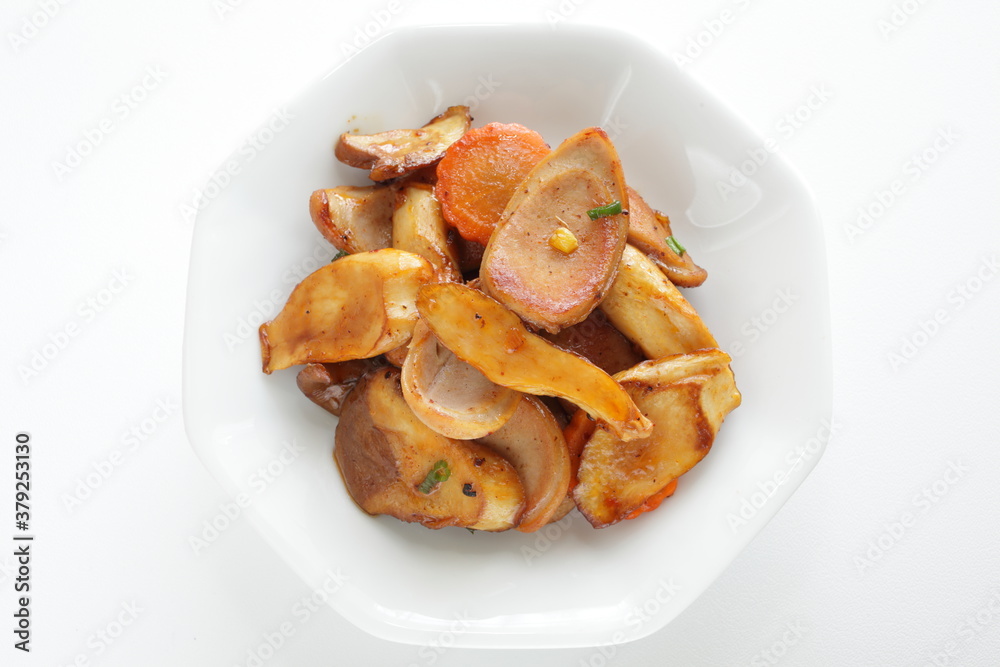Chinese food, sausage and Eringi mushroom stir fried with carrot Chinese food, sausage and Eringi mushroom stir fried with carrot