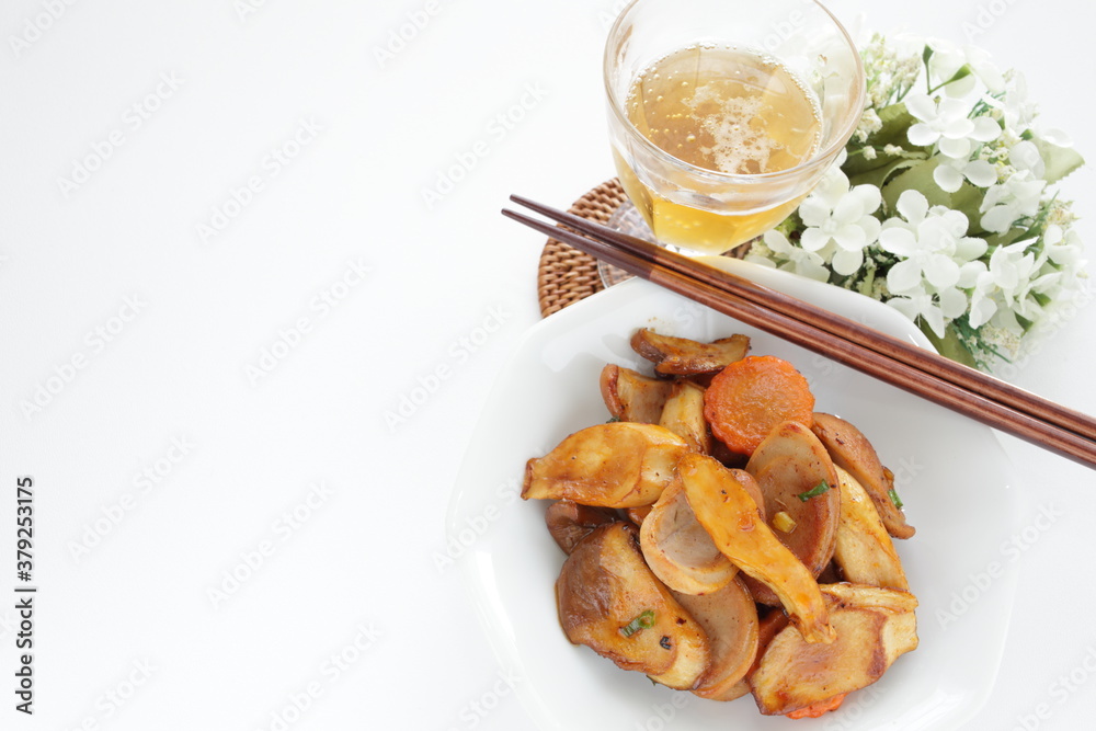 Chinese food, sausage and Eringi mushroom stir fried with iced tea Chinese food, sausage and Eringi mushroom stir fried with iced tea
