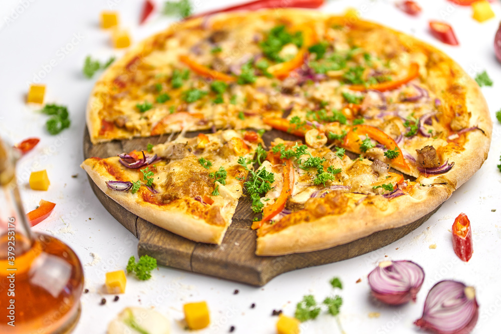 Pizza with chicken, mushrooms and sweet pepper on wooden plate Pizza with chicken, mushrooms and sweet pepper on wooden plate