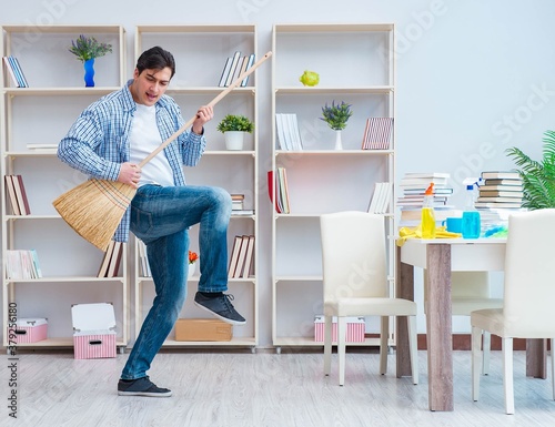 The man doing cleaning at home