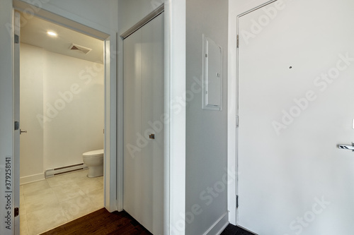 Real estate photography - Beautiful empty brand new apartment in an apartment building with bathroom  new kitchen  new floors  all white painted