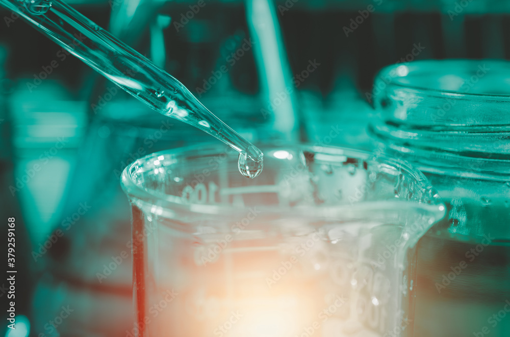 Pipette dropping a sample into a test tube and science experiments ,Laboratory glassware containing chemical liquid, Pipette dropping a sample into a test tube and science experiments ,Laboratory glassware containing chemical liquid,