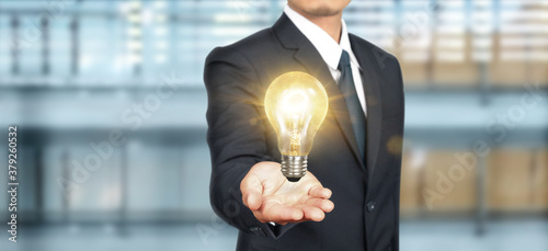 Hand of holding light bulb. idea innovation inspiration concept