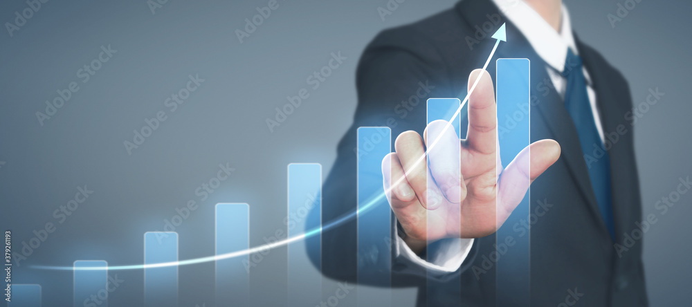 Businessman plan graph growth and increase of chart positive indicators in his business Businessman plan graph growth and increase of chart positive indicators in his business
