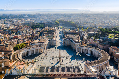 Aerial view of the square in front of St. Peter's Basilica and the city of Rome, stretching to the horizon