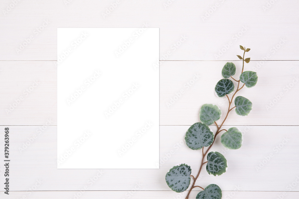 Blank paper sheet copy space with mockup and leaf on wooden table, poster and invitation, postcard decoration your design or branding, simplicity and minimal, nobody, flat lay, top view. Blank paper sheet copy space with mockup and leaf on wooden table, poster and invitation, postcard decoration your design or branding, simplicity and minimal, nobody, flat lay, top view.
