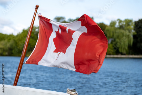 Canadian flag flies on boat's stern
