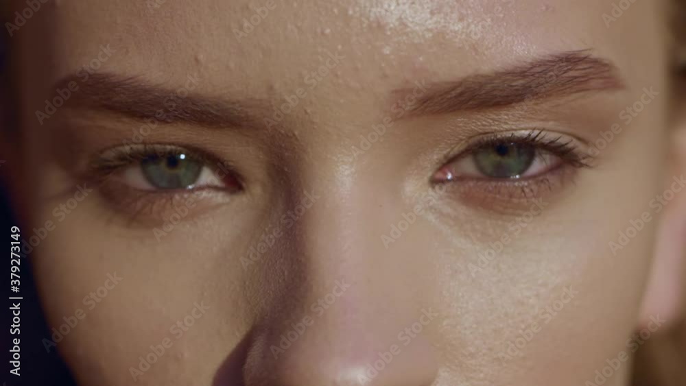 Close up young face woman with green eyes at sunset beautiful model cute eyebrow attractive eyelash portrait slow motion