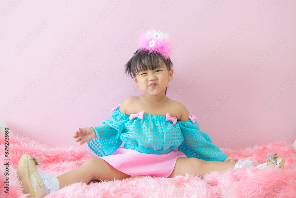 Portrait of Little child girl smile smiling on sofa at living room Portrait of Little child girl smile smiling on sofa at living room