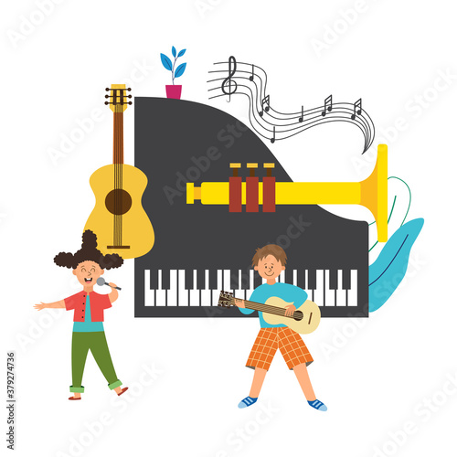 Music school children singing and playing guitar on musical instruments