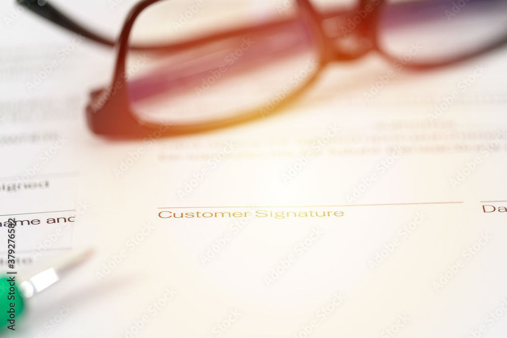 Sign on contract document with fountain pen and glasses Sign on contract document with fountain pen and glasses