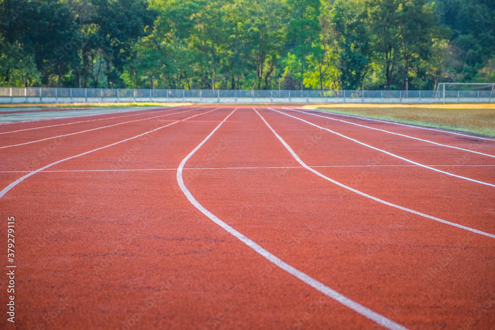 Empty red running track in the arena stadium. Empty red running track in the arena stadium.