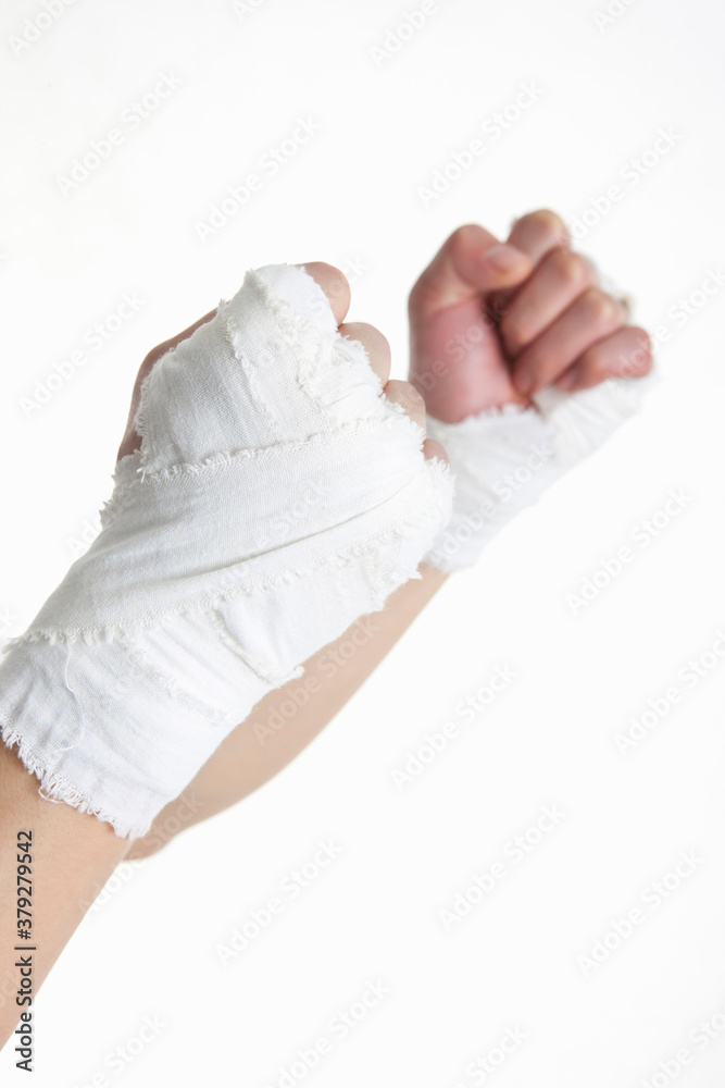 Obraz premium bandaged fists on white background