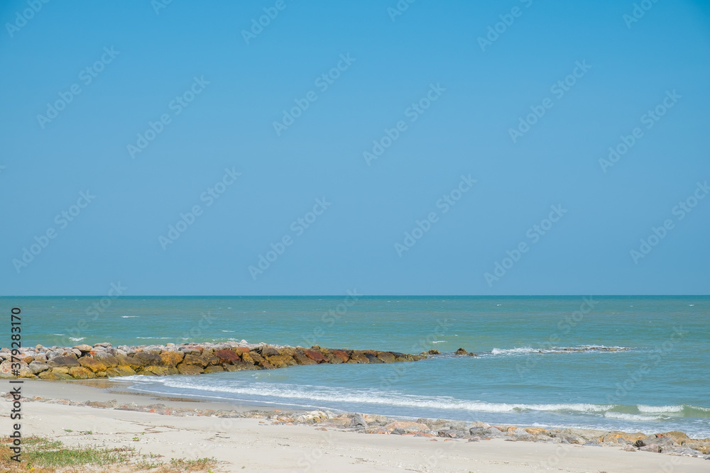 Beautiful golden sunset with blue sky over the horizon on the beach background, Thailand. Tropical twilight colorful sunrise from the landscape sea. Summer vacation concept. Beautiful golden sunset with blue sky over the horizon on the beach background, Thailand. Tropical twilight colorful sunrise from the landscape sea. Summer vacation concept.