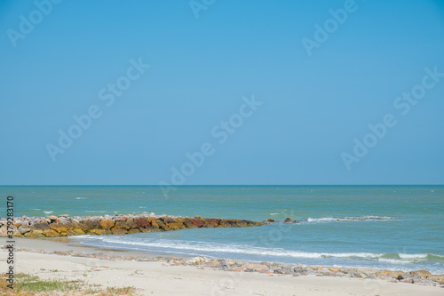 Beautiful golden sunset with blue sky over the horizon on the beach background  Thailand. Tropical twilight colorful sunrise from the landscape sea. Summer vacation concept.