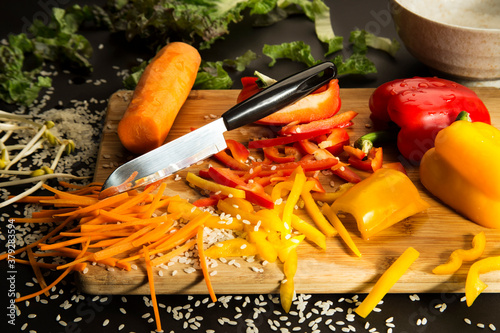 chopped vegetables on a wooden chopping board