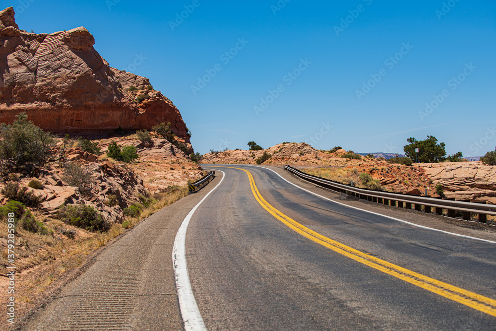 Natural american landscape with asphalt road to horizon.