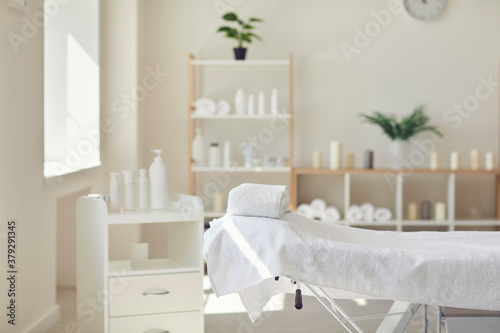 Interior of newly opened modern massage salon with all the necessary supplies ready photo