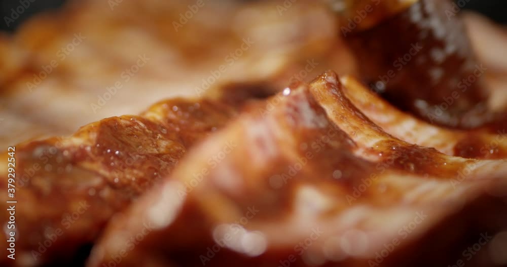 Fresh raw ribs are smeared with sauce for cooking. Fresh raw ribs are smeared with sauce for cooking.