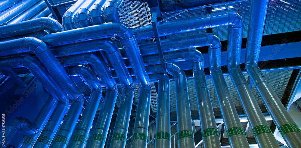 Fototapeta premium Industrial zone, Steel pipelines in green tones