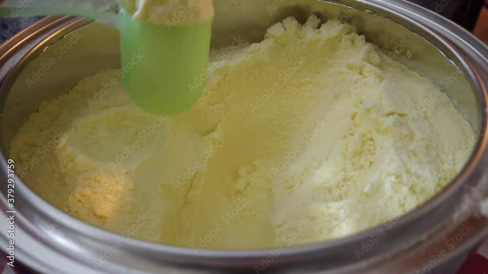 Preparing baby milk powder drink for feeding newborn baby. 24 frame rate per seconds