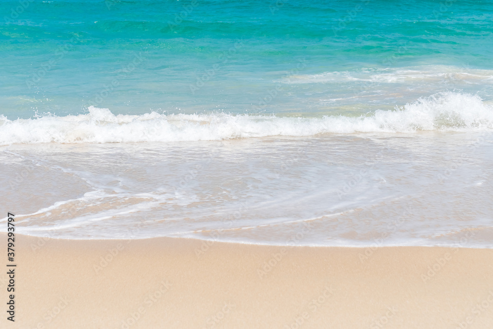 Tropical nature clean beach and white sand in summer with sun light blue sky and bokeh.