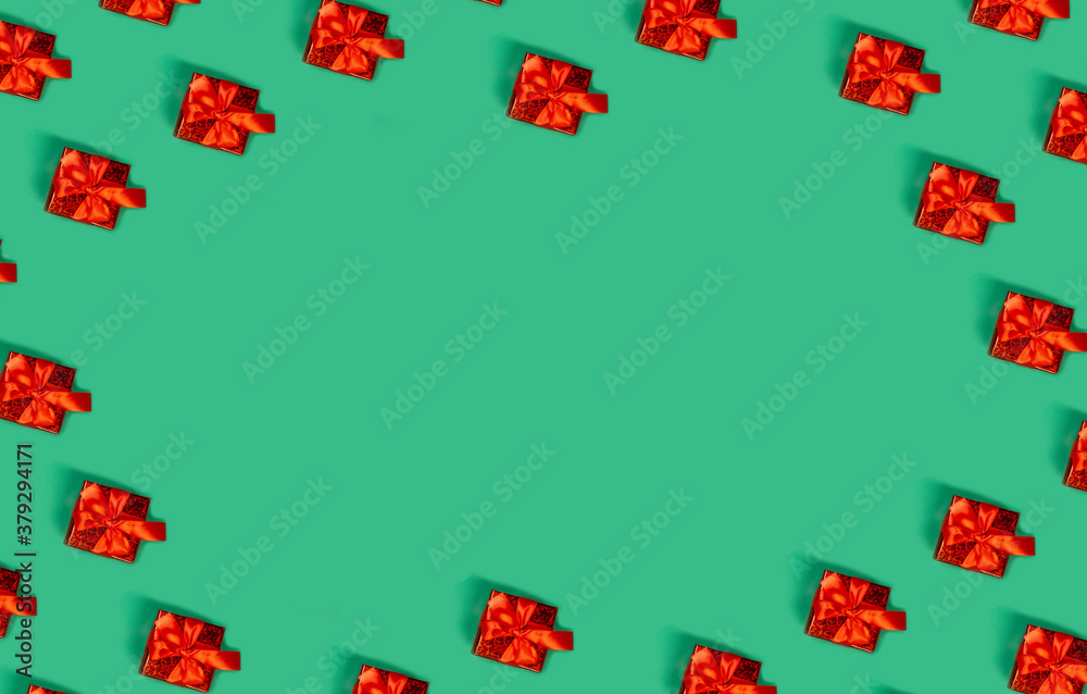 New Year's gift on a green background with space for text, holiday gifts concept