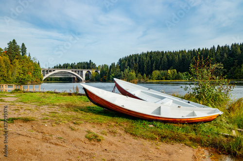 Autumn landscape of bridge and boats on Kymijoki river in Finland, Kouvola, Koria © Elena Noeva