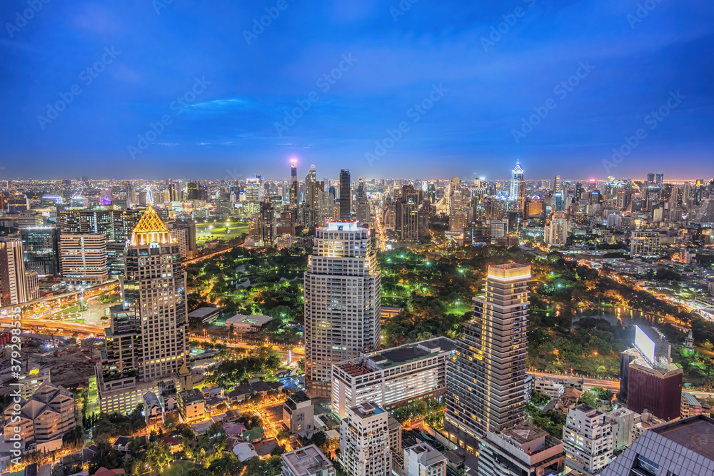 Bangkok Thailand, night city skyline of skyscraper at Bangkok downtown and Lumpini Park - obrazy, fototapety, plakaty 