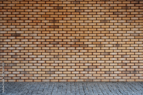 Valokuva Brick wall and pavement background