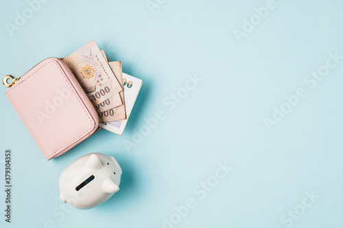 Saving piggy bank with wall...