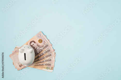 Saving piggy bank with Thai...